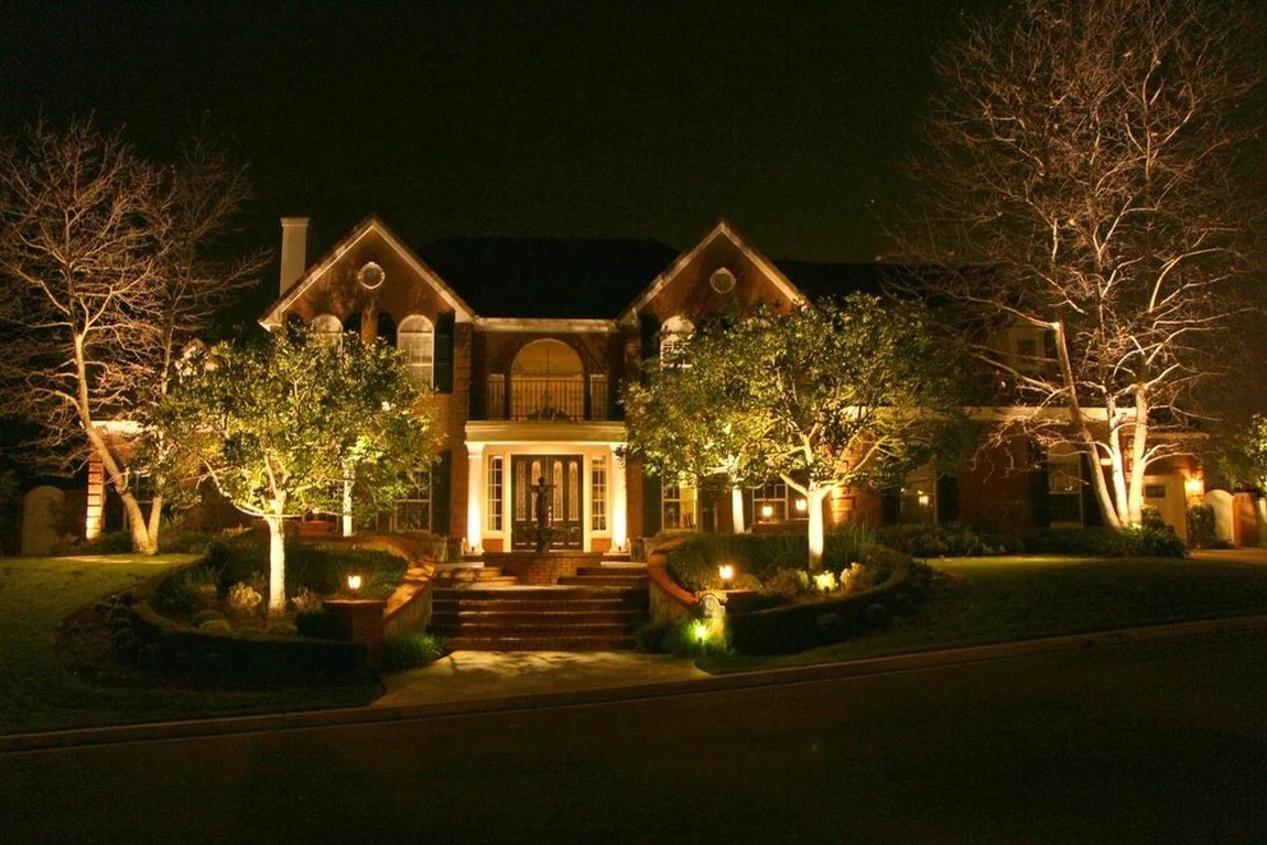 Architectural facade uplighting on a home at dusk
